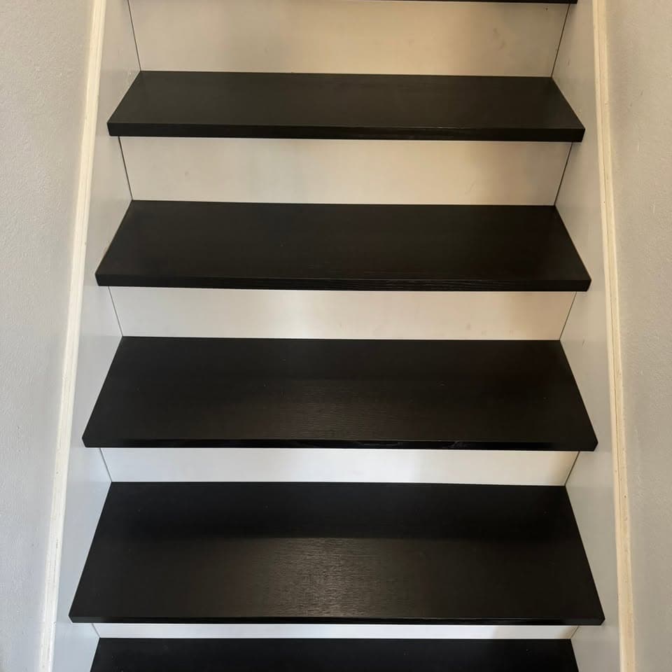 Finished staircase with dark treads and light risers